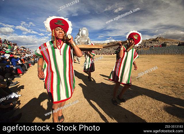 Indigenous people with traditional costumes during a shamanic performance at the Inti Raymi Festival in Saqsaywaman Archaeological Site, Cusco, Peru