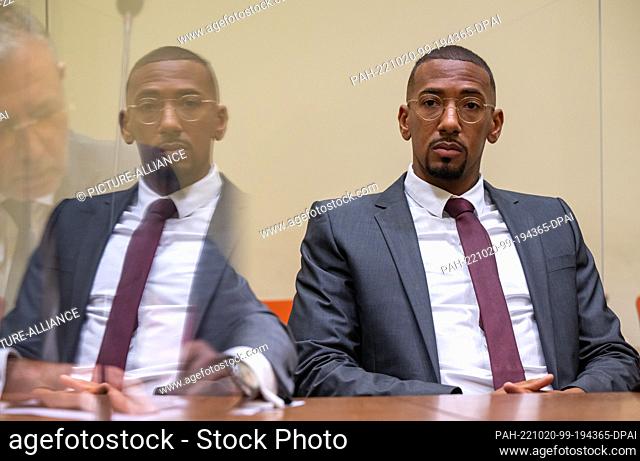 20 October 2022, Bavaria, Munich: Professional soccer player and former national team player Jerome Boateng sits in the courtroom of the Munich I Regional Court...