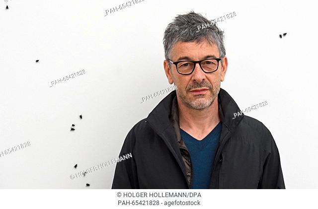 French artist Pierre Huyghe pictured in a room filled with house flies at the Sprengel Museum in Hanover, Germany, 28 January 2016
