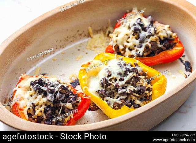 baked peppers filled with minced meat, rice, beans and cheese