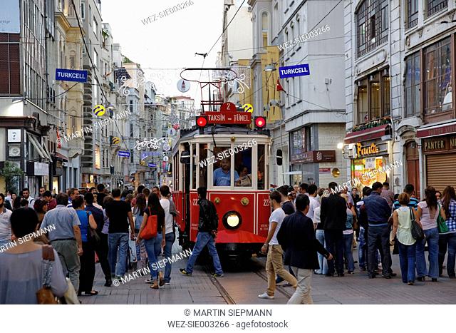 Turkey, Istanbul, People and historical tram on Istiklal Caddesi road