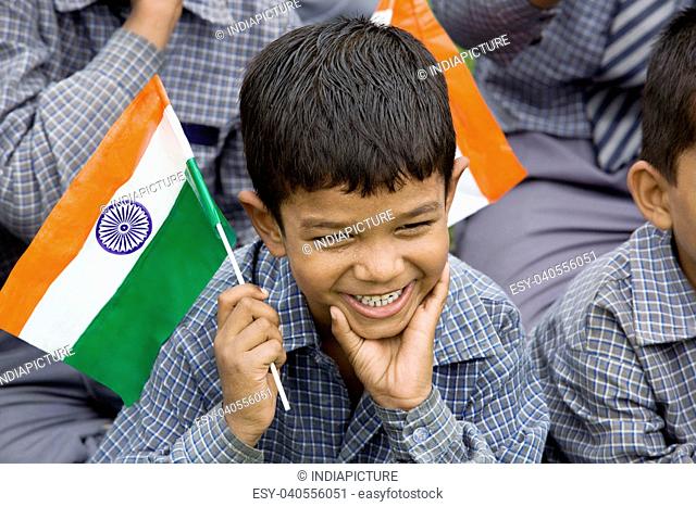 School boy holding the Indian Flag