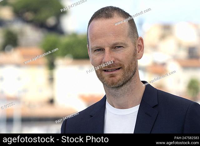 Director Joachim Trier poses at the photocall of 'Verdens Verste Menneske (The Worst Person In The World)' during the 74th Annual Cannes Film Festival at Palais...