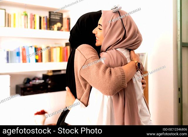 Female friends hugging