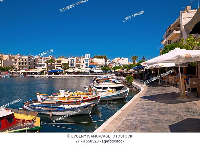 Boats and restaurants on lake Voulismeni in Agios Nikolaos, Crete, Greece