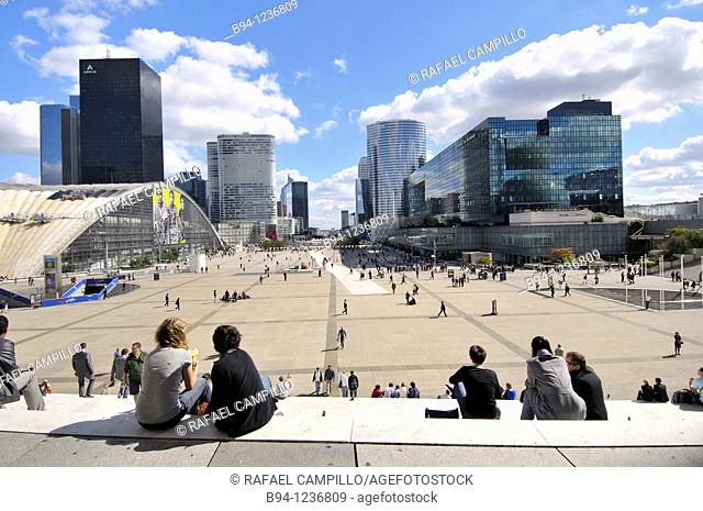 People sitting on the stairs of the Grande Arche (1989 by Danish architect Otto von Spreckelsen and Danish engineer Erik Reitzel), La Defense business district