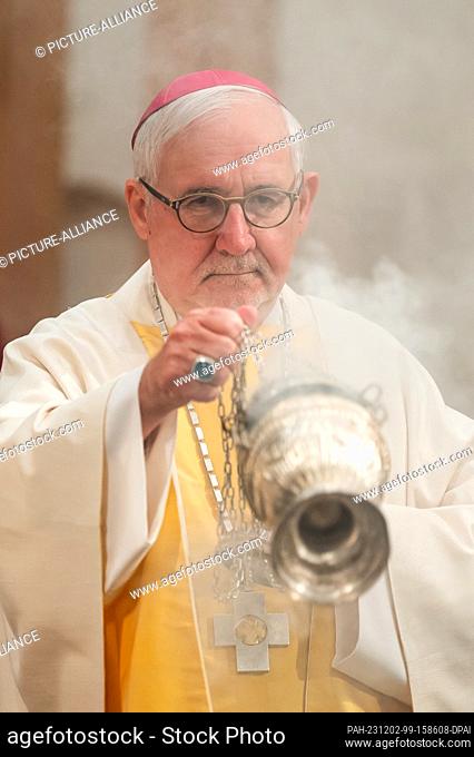 02 December 2023, Baden-Württemberg, Rottenburg am Neckar: Gebhard Fürst, Bishop of the Diocese of Rottenburg-Stuttgart, with a censer for incense at the...