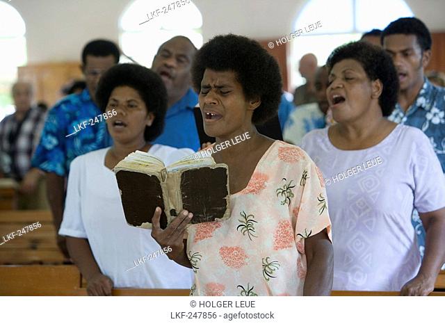 People singing at church service at the village Naidi, Vanua Levu, Fiji Islands, South Pacific, Oceania