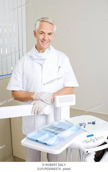 Dentist preparing for examination in examination room