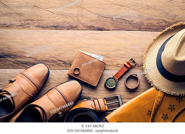 Clothing and accessories for men on wood floor