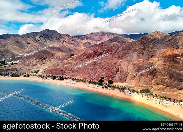 Aerial photography drone point of view of Playa de Las Teresitas beach picturesque distant view of mountainous terrain bright colors Atlantic Ocean