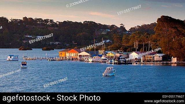 Boats in Wagonga Inlet at sunset in Narooma, New South Wales, Australia