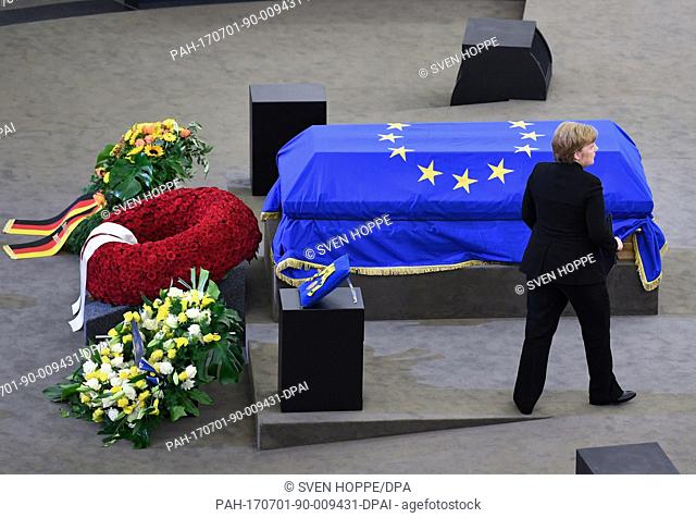 German Chancellor Angela Merkel (CDU) stands in front of the coffin during the European obsequies for late former chancellor Helmut Kohl at the European...