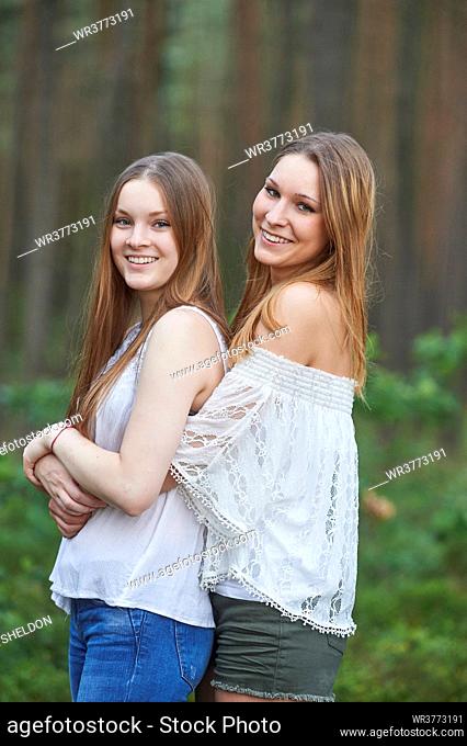 Two female cousins having fun, Bavaria, Germany, Europe