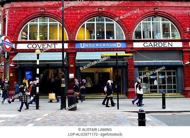 England, London, Covent Garden. People passing the entrance to Covent Garden Underground Station