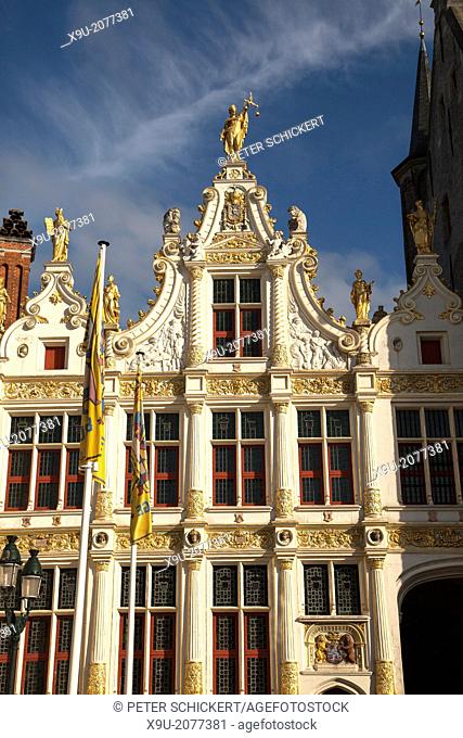 Justitia on the Chancellory decorated with gold in the historic center of Bruges, Belgium