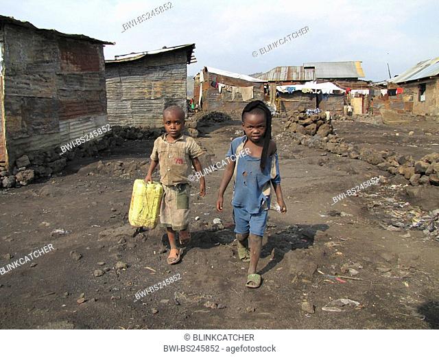 children fetching water with canisters in a poor part of the city of Goma, being called the 'burned quarter' 'quartier brul' since fire breaks out regularly in...