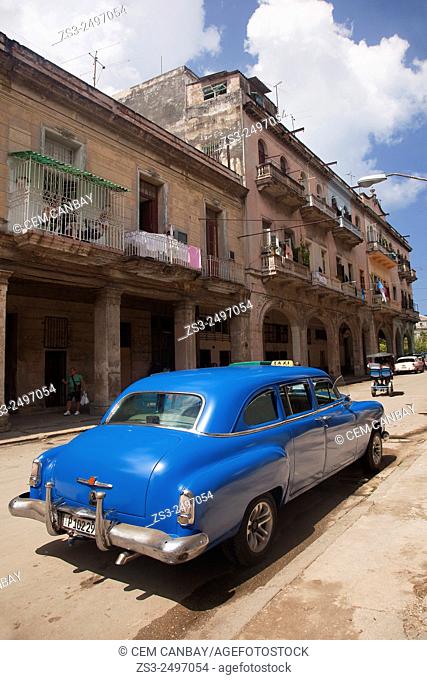 Old American cars used as taxi at the street in Central Havana, Cuba, West Indies, Central America