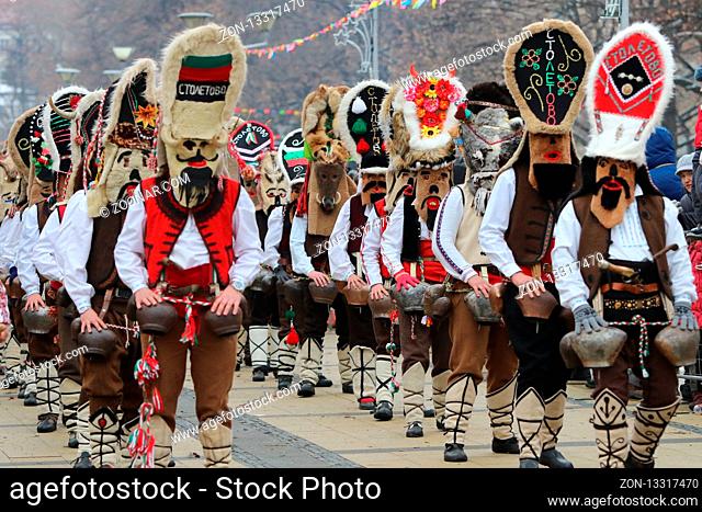 Pernik, Bulgaria - January 27, 2019 - Masquerade festival Surva in Pernik, Bulgaria. People with mask called Kukeri dance and perform to scare the evil spirits