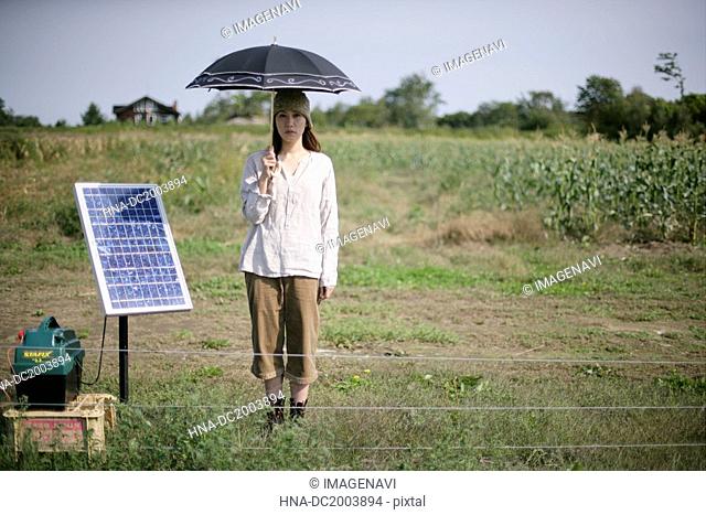 A woman and solar panel