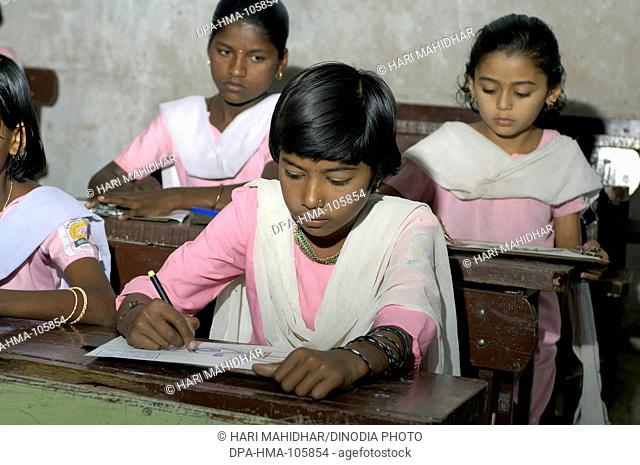 Girls in classroom of school at Ralegan Siddhi near Pune ; Maharashtra ; India