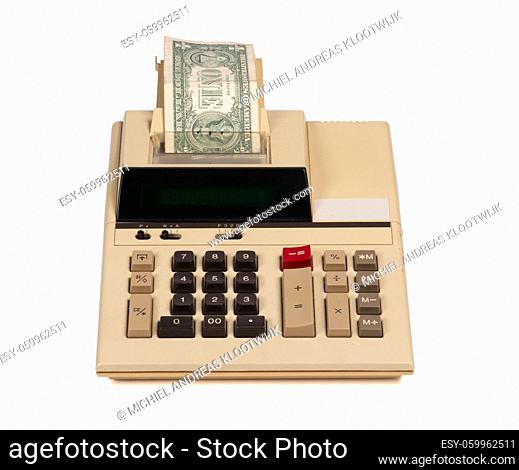 Old fashioned calculator and one dollar, isolated on white