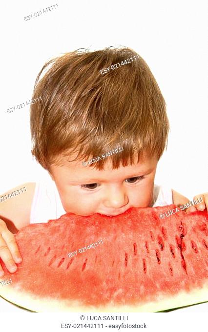girl eating a slice of watermelon
