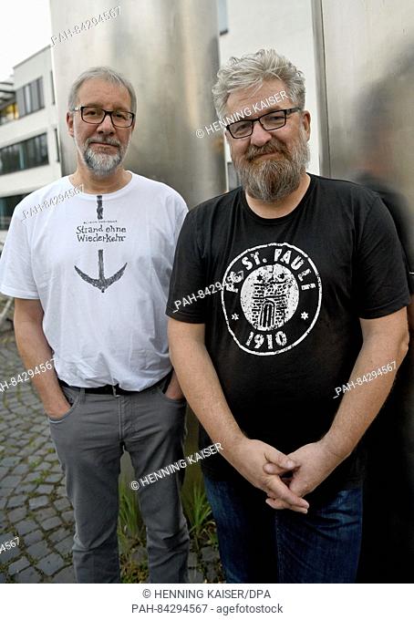 The authors Arnd Rueskamp (l) and Hendrik Neubauer (r) posing before a reading from their book 'Strand ohne Wiederkehr' (lit