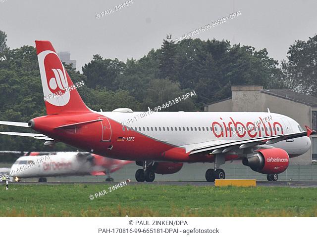 An Air Berlin plane taxiing to a runway in the rain at Tegel Airport in Berlin, Germany, 16Â August 2017. The airline filed for insolvency on 15 August