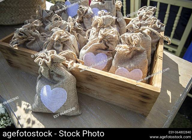 Sachets of rice ready to throw away after a wedding ceremony. Wooden box container