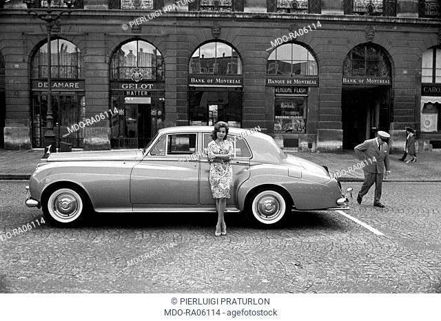 American actress Abbe Lane (Abigail Francine Lassman) posing with her Rolls Royce. Paris, 13th August 1962
