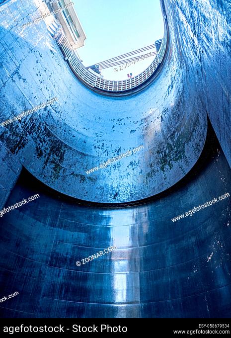 View towards the sky inside the very deep lock of the Barragem do Carrapatelo on Douro River in Portugal