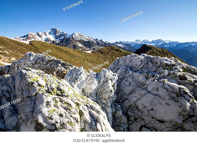 Sasso Bianco frames the snowy peak of Mount Disgrazia, Malenco Valley, Valtellina, Province of Sondrio, Lombardy, Italy, Europe