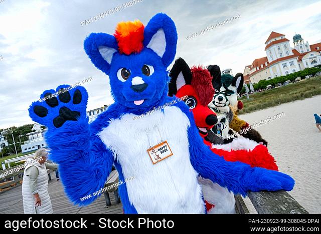 23 September 2023, Mecklenburg-Western Pomerania, Binz: With colorful animal costumes, participants of the ""Furry Treffen"" stand on the pier