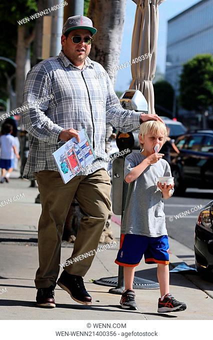 Jonah Hill takes one of his nephews out for frozen yogurt in Beverly Hills. Hill carries the tots coloring book while heading back to the car