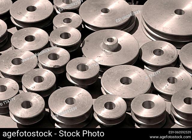 Silver aluminium belt pulley stack on outdoors market