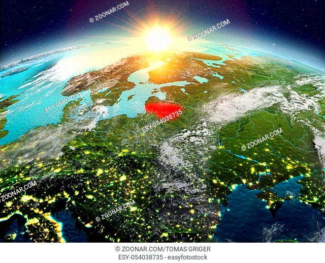 Satellite view of Lithuania highlighted in red on planet Earth with clouds during sunrise. 3D illustration. Elements of this image furnished by NASA