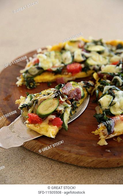Courgette frittata with bacon, baby spinach and eggs