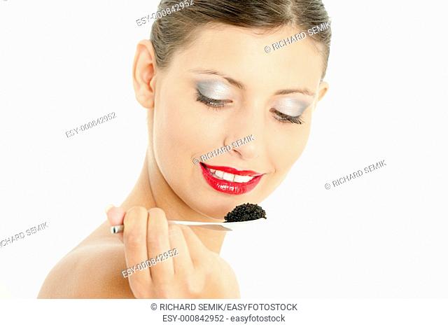 portrait of woman with black caviar