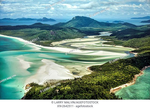 Aerial view from Hill Inlet of the waters and swirling sands of Whitsunday Island with Whitehaven Beach in the distance in Queensland, Australia