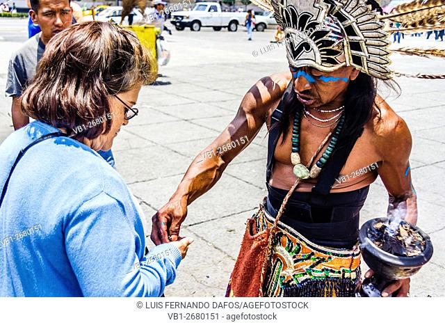 Aztec shaman doing a ""limpia"" (cleansing), Zocalo Square, Mexico DF