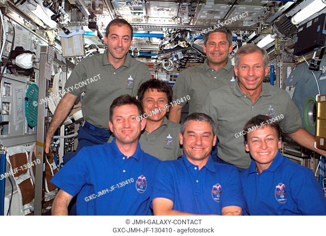 The Expedition Five (front row) and STS-111 crews assemble for a group photo in the Destiny laboratory on the International Space Station (ISS)
