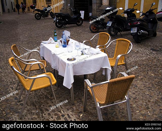 outdoor table at a restaurant after clients have left, Cordoba, Andalusia, Spain