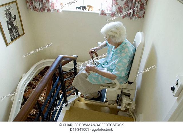 Elderly woman on stairlift