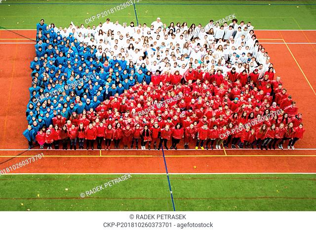 520 pupils and teachers of the Hus elementary school in Liberec dressed in Czech national colors and stand in the form of Czech flag