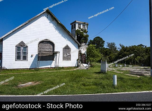 Deal Island, Maryland USA An old and abandoned church and graveyard where gravestones have risen due to marshy land