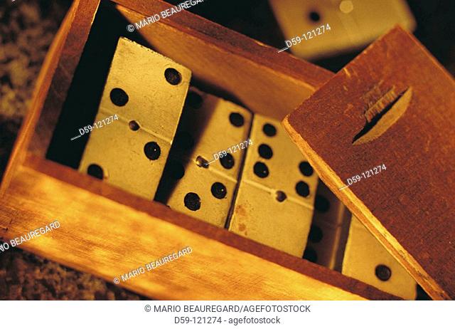 Close-up of dominoes in wooden box