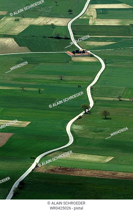 High angle view of a path passing through a field, Monti Sibillini National Park, Umbria, Italy