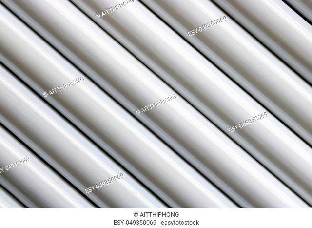 Texture of white steel pipe sort in diagonal, abstract background