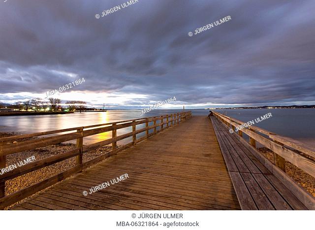 Wooden jetty at night, clouds